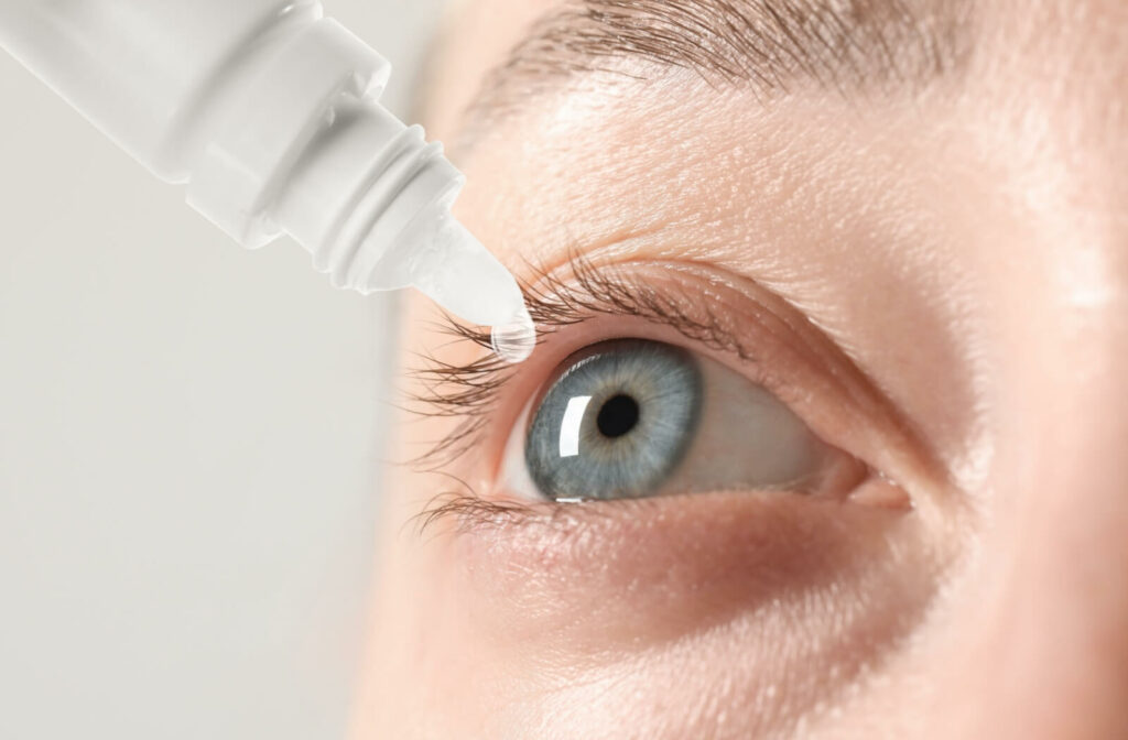 A close up of eye drops in one eye.